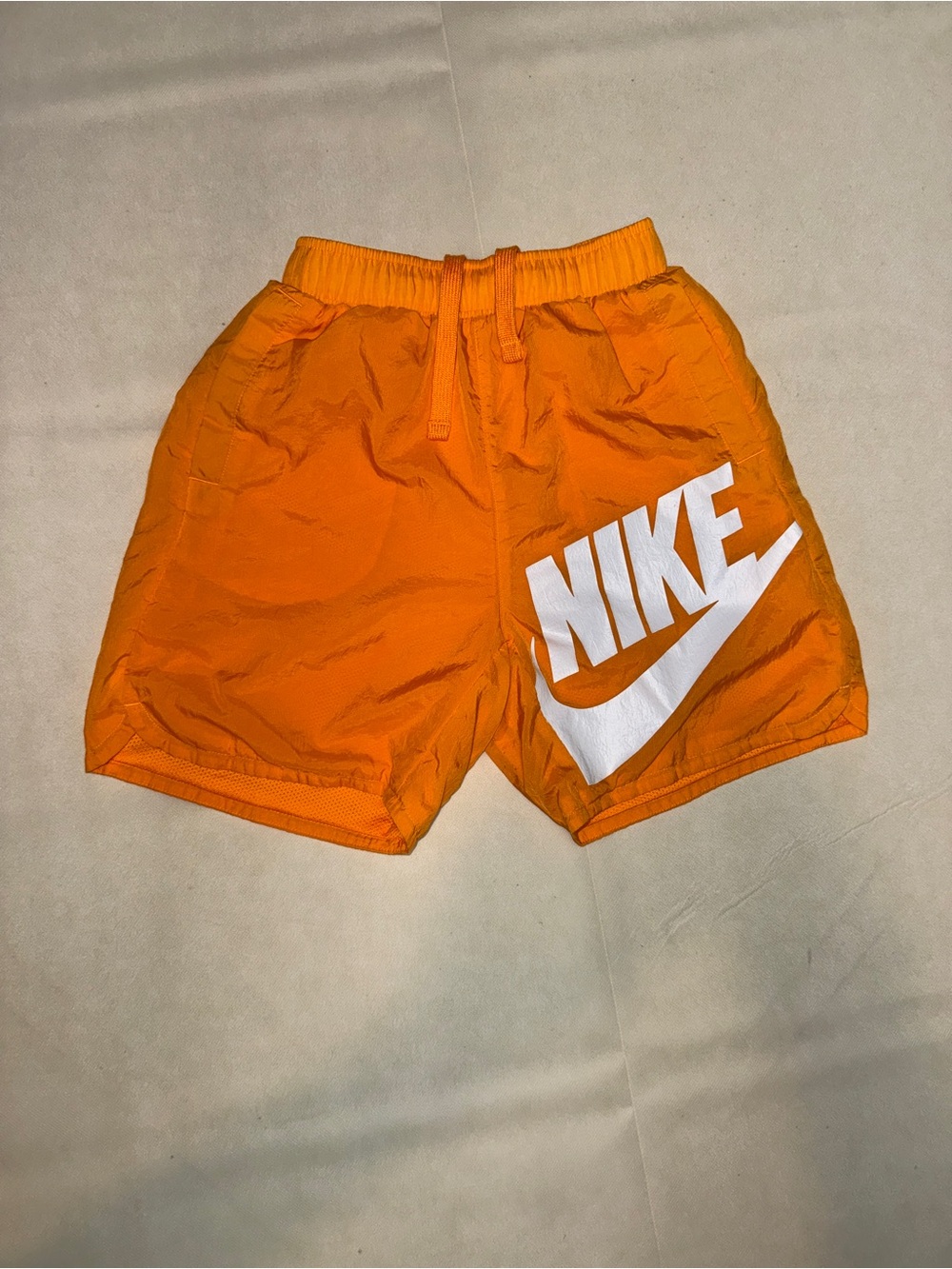 Nike Orange Athletic Shorts with Large White Logo